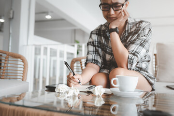 beautiful woman think and write notes on paper working freedom from office at home. alternative lifestyle and place to work on. Nice life daily scene