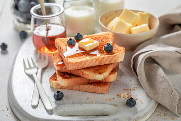 Delicious french toast with fresh berries and honey