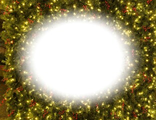 Christmas themed background of green fir needles with holiday lights and copy space for text