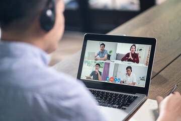 Asian businessman working from home, making video conference meeting.