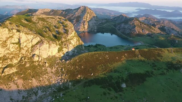 Picturesque landscape of highland Lakes of Covadonga within Picos de Europa National Park at sunset