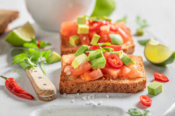 Vegetarian Toast with tomatoes, avocado and coriander