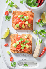 Homemade Toast made of tomatoes, chilli pepper and avocado