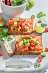 Tasty Toast with tomatoes, avocado and coriander