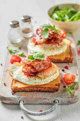 Unhealthy toast with egg, bacon and cheese