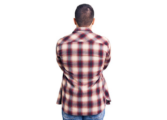 Young handsome man wearing casual shirt standing backwards looking away with crossed arms