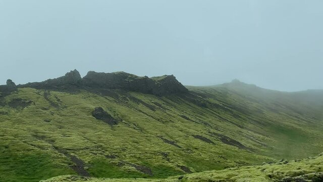Traveling through Iceland, nearby geologically structured hills - (4K)
