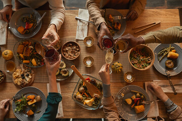 Above view background of multi-ethnic group of people enjoying feast during dinner party with...