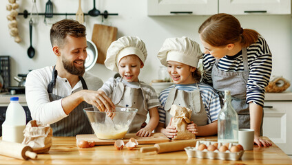 Positive family preparing pastry together