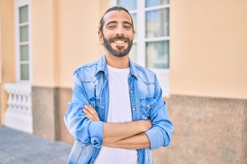 Fototapeta premium Young middle eastern man smiling happy walking at the city.