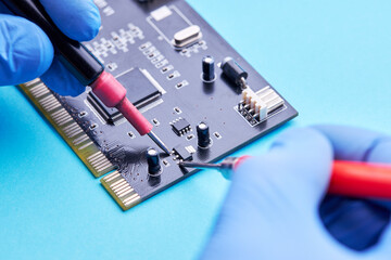 computer hardware support service concept. technician diagnosing and repairing pcb circuit board