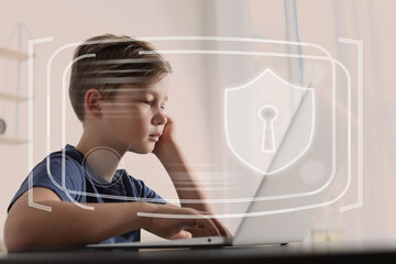 Child safety online. Little boy using laptop at home. Illustration of internet blocking app on...