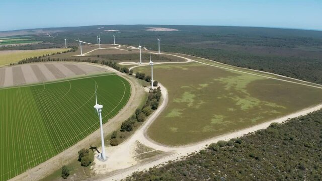 Wind Turbines in the Australian Outback. Aerial drone footage of wind turbine farm generating power. 