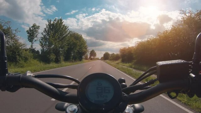 modern scrambler motorbike on the forest road riding. having fun driving the empty road on a motorcycle tour journey.