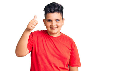 Little boy kid wearing casual clothes smiling happy and positive, thumb up doing excellent and approval sign