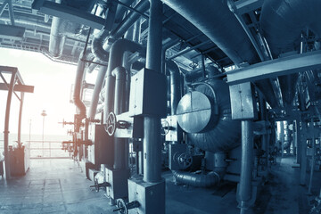 Industry plant concept,Equipment, cables and piping as found inside of a modern industrial power plant or offshore platform