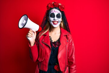 Obraz premium Woman wearing day of the dead costume using megaphone winking looking at the camera with sexy expression, cheerful and happy face.