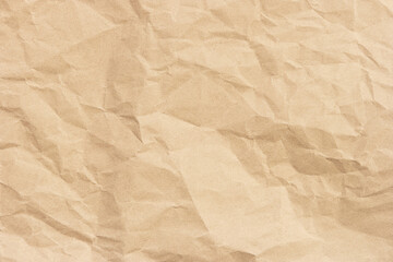 Brown crumpled paper texture background with space for design.
