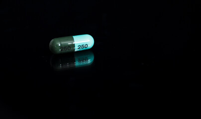 Medical concept, Drug capsule for treatment on black background.