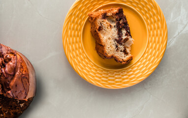 Traditional Christmas panettone (Chocottone) on yellow plate