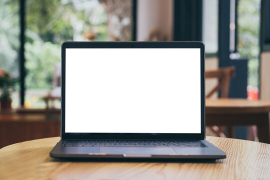 computer mockup blank screen.laptop with white background for advertising,contact business search information on desk at coffee shop.marketing and creative design