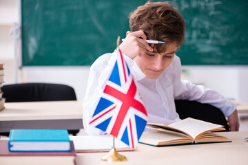 Schoolboy learning english language via Internet - obrazy, fototapety, plakaty