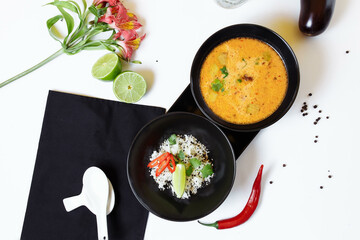 Tom Kha. Spicy spicy Asian soup with eggplant, chicken, mushrooms, lemongrass, served with rice and cilantro