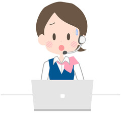 困った表情で電話応対をするオペレーター