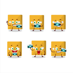 Photographer profession emoticon with yellow dice cartoon character