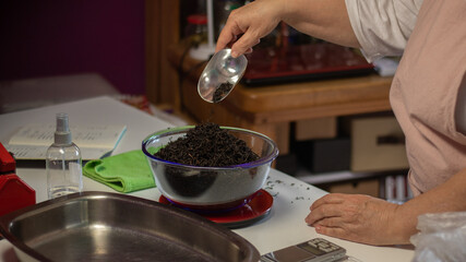 Fototapeta na wymiar close up of a woman making a tea blend
