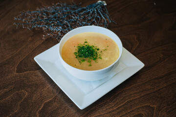 Diet chicken soup. Lean broth. Nutrition for gastritis and coronavirus. Healthy food. White cup on dark background