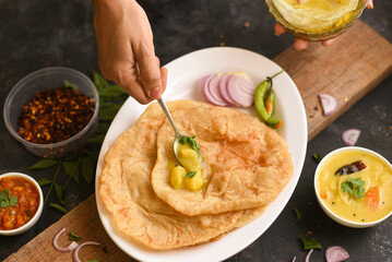 Puri Bhaji North India Poori is breakfast food a deep fried bread made from whole wheat flour Served with dal curry, Potato curry , bhaji , Kerala,  Mumbai , India	