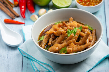 thai food ; Stewed Chicken Feet soup served with spicy fish sauce