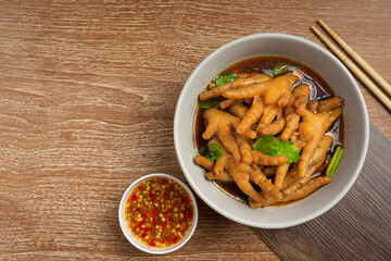 thai food ; Stewed Chicken Feet soup served with spicy fish sauce