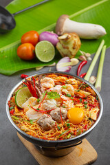 Thai food; instant noodles spicy boil with seafood and pork in hot pot