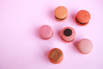 assortment colorful  korean macaroons on pink background
