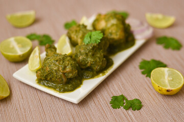 Green chicken Curry , Chicken Hariyali Tikka,    Chicken Hara Masala , chicken hariyali Indian style. palak spinach Chicken or Murg Saagwala served in  with coriander leaf,.Hyderabad India
