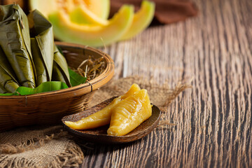 Thai dessert ; Cantaloupe steamed pastries wrapped in banana leaf cone