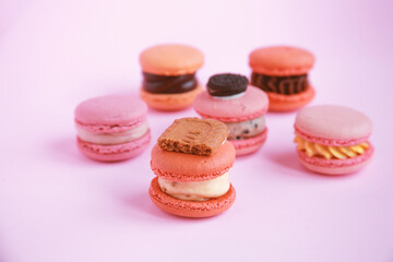 assortment colorful  korean macaroons on pink background