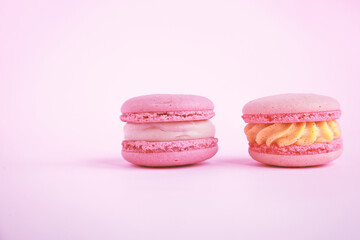 assortment colorful  korean macaroons on pink background