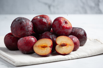 plums put on a white fabric