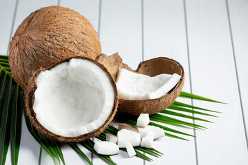 fresh coconuts put on white wooden background