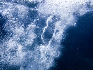 Fototapeta na wymiar Air bubbles underwater sea rising to water surface, natural scene, Mediterranean,bubbles undersea