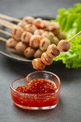 Toasted meatballs topped with spicy sauce