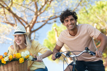 happy playful couple on bikes