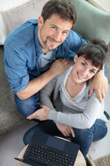 couple sitting on a sofa in the luxury living room