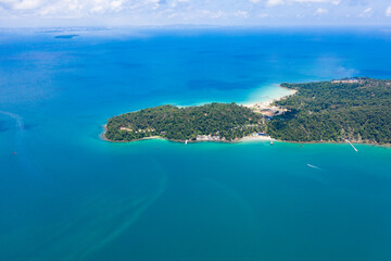 Long deserted beach with white sand and clear water. Aerial top view. island Koh Rong Samloem, Sihanoukville, Cambodia. This is a small island that attracts many vi. White sand beach and calm sea.