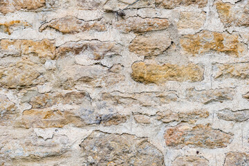 Stone wall of the Arlington Row cottages in Bibury, Cotswalds, England, for background