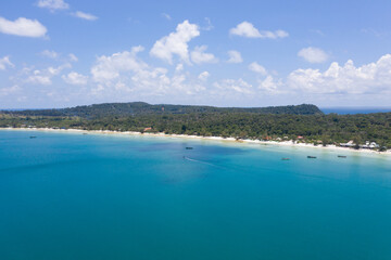 Fototapeta na wymiar Long deserted beach with white sand and clear water. Aerial top view. island Koh Rong Samloem, Sihanoukville, Cambodia. This is a small island that attracts many vi. White sand beach and calm sea.