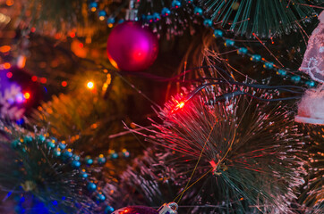 Obraz na płótnie Canvas Christmas decorations and garland on artificial tree